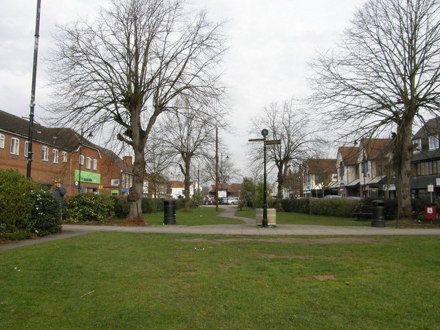 Thatcham Broadway town green with shops and fingerpost sign