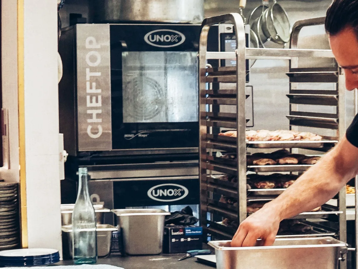 Stacked commercial kitchen ovens in a professional catering kitchen