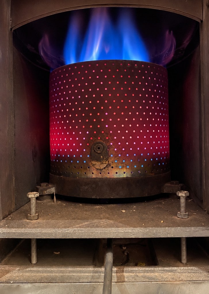 Aga cooker burner with a visible flame